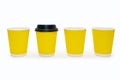 Four disposable cardboard cups lined up in a row on a white background Royalty Free Stock Photo