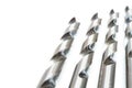 Four Drill bits on white background. Royalty Free Stock Photo