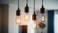 Four Edison bulb light fixtures hang from ceiling, illuminating modern interior Royalty Free Stock Photo