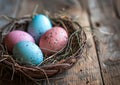 Four eggs in a nest, resting on a wooden table, surrounded by natural twigs Royalty Free Stock Photo