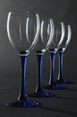 Four empty blue wine glasses Royalty Free Stock Photo