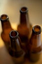 Four empty glass beer bottles. Royalty Free Stock Photo