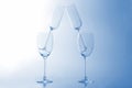 Four empty wine glass on a light blue background Royalty Free Stock Photo