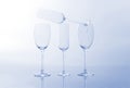 Four empty wine glass on a light blue background Royalty Free Stock Photo