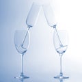 Four empty wine glass on a light blue background Royalty Free Stock Photo