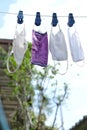 The four face masks are made of fabric hanging under the clothes rack. When used, it is necessary to wash and dry in the sun.