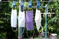 The four face masks are made of fabric hanging under the clothes rack. When used, it is necessary to wash and dry in the sun.