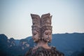 Four faced sculpture at the entrance to the Romance Park