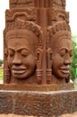 The four faces of buddah statue in sandstone. phnom penh, cambodia. Royalty Free Stock Photo