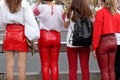 Four female protesters dressed in national Belarussian colors