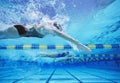 Four female swimmers racing together in swimming pool