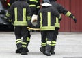 four firefighters carrying injured Royalty Free Stock Photo