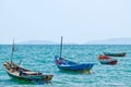 Four fisherman boats moored at sea.