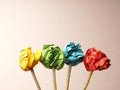 Four flower stems with colorful paper balls as flowers