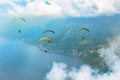 Four flying paragliders in front of spectacular Garda Lake in Malcesine,Italy Royalty Free Stock Photo