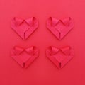 four folding red paper hearts on red for valentine pattern and b