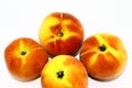 Four fresh peaches on white background Royalty Free Stock Photo