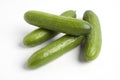 Four fresh small cucumbers