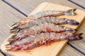 Four fresh whole tiger prawns