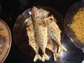 Four fried fishes in the plate for lunch