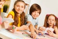 Four friends playing cards sitting at gaming table Royalty Free Stock Photo