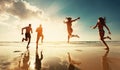 Four friends runs at sunset sea beach Royalty Free Stock Photo