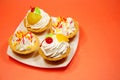 Four fruit cakes on a saucer