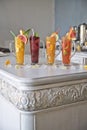 Four fruit cocktails on a vintage table. Healthy healthy drinks. Freshness and aroma.