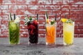 Four fruit cocktails on table.