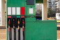 Four fuel pumps at a gas station.