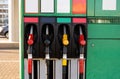 Four fuel pumps at a gas station.