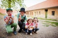 Four funny children eat ice cream outdoor