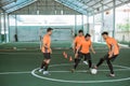 four futsal players practice with the ball Royalty Free Stock Photo