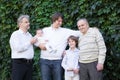 Four generations of men standing in the garden