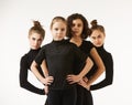 Four girls of different ages in dance poses and black clothes Royalty Free Stock Photo