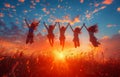 Four girls jumping on the field under blue sky Royalty Free Stock Photo