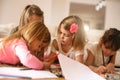 Four girls lying on the floor. Royalty Free Stock Photo