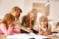 Four girls lying on the floor. Royalty Free Stock Photo