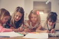 Four girls lying on the floor. Royalty Free Stock Photo