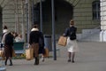 Four girls with shopping paper bags on the weekend shopping tour in Bern, Switzerland. Royalty Free Stock Photo