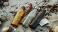 Four Glass Bottles on a Sandy Beach Royalty Free Stock Photo