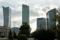 Four glass central buildings in poland against a blue sky