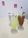 Four glass cups of fresh drink