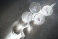 Four glasses with champagne on a light table surface reflecting soft sunshine rayson Royalty Free Stock Photo