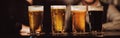 four glasses with different beers on bar counter in pub Royalty Free Stock Photo