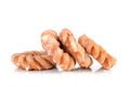 Four glazed cruller donuts in a messy pile Royalty Free Stock Photo