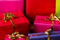 Four Golden Bows around Wrapped Presents Royalty Free Stock Photo