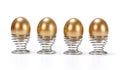 Four golden eggs in a row Royalty Free Stock Photo