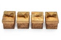 Four golden gift boxes aligned isolated on white background Royalty Free Stock Photo
