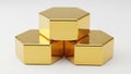 Golden hexagonal prisms stacked in a pyramid formation isolated on white background Royalty Free Stock Photo